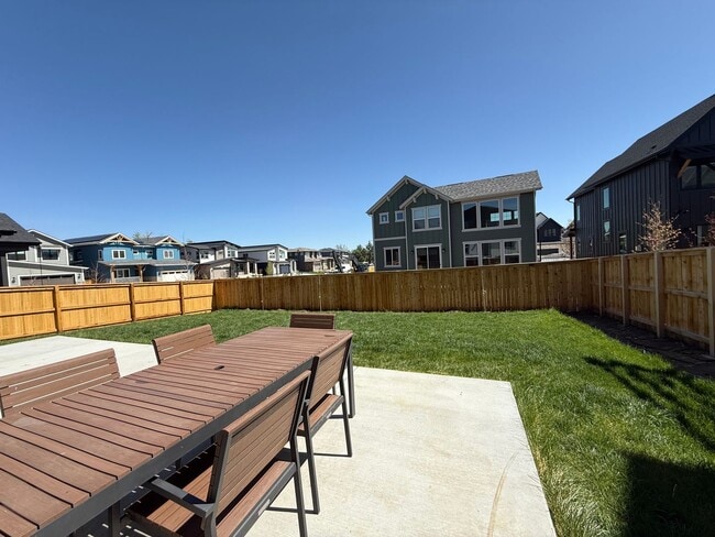 Building Photo - Stunning Luxury Living in Coal Creek with ...