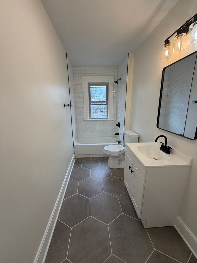 Building Photo - Rare 2-Full Bath Find: Pristine Renovation with Designer En-Suite & Granite