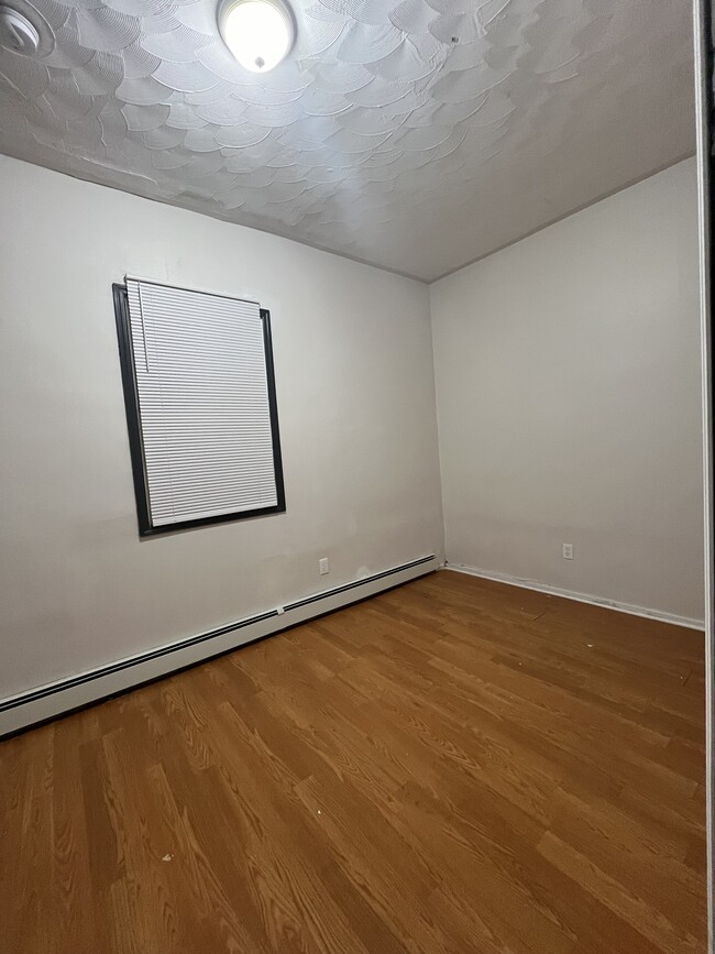 Bedroom #2 - new paintwork and baseboard heater - 125 S 9th St