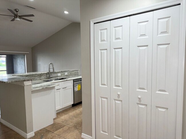 Building Photo - Experience this Cape Coral 3 bedroom 2 bath corner duplex with 1 car garage and screened in lanai.