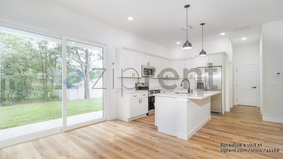 Building Photo - 8202 N Triana Dr