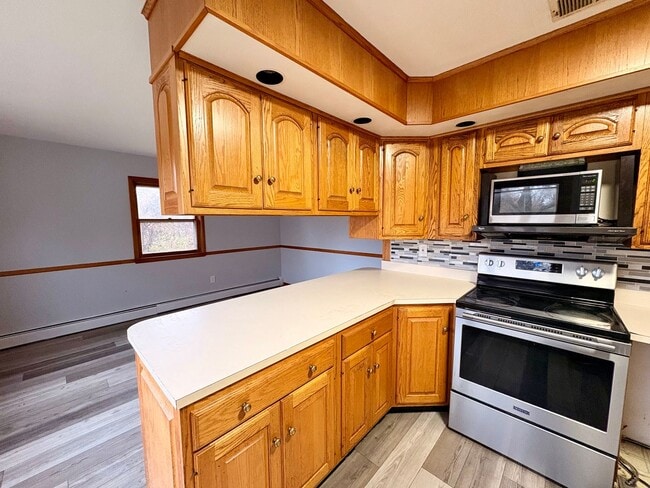 Building Photo - Sprawling Brick Ranch with Huge Lot & Garage in Prime Nottingham Location