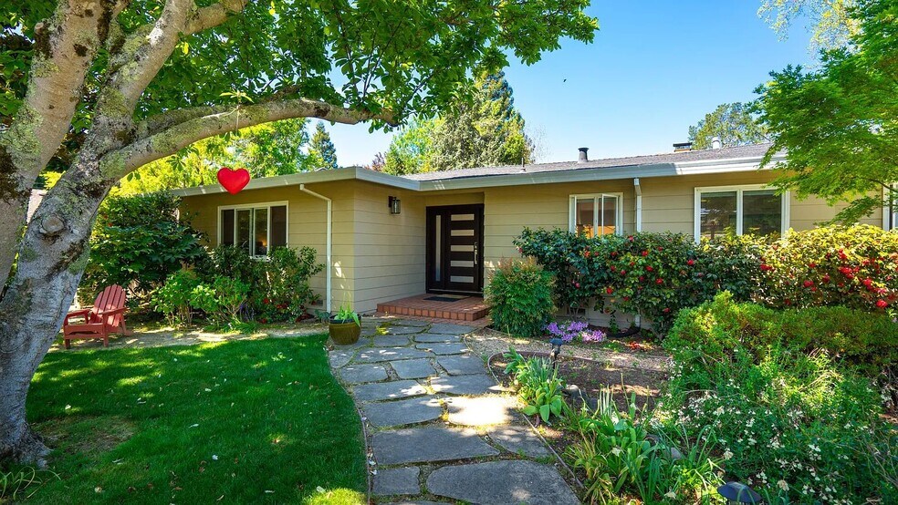 Front of house. Magnolia Tree above is a pink petal storm on Valentine's Day - 1415 Butterfield Rd