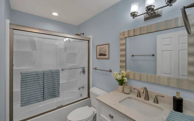 Building Photo - Turnkey ground floor condo in the coveted ...