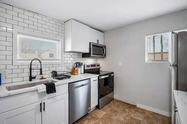 Building Photo - Remodeled and Furnished 1BD, 1BA in the Highlands with Off-Street Parking Spot