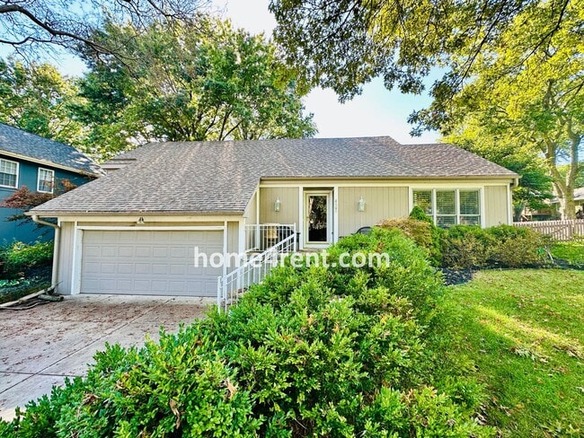 Building Photo - A Lovely Lenexa Home w/ Wood Floors Throughout, Updated Kitchen, Finished Basement and a Fenced Y...