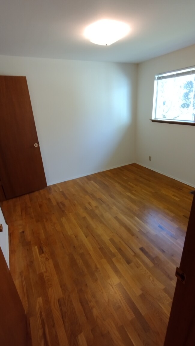 Each bedroom has upgraded outlets and refinished hardwood floors - 23204 64th Ave W