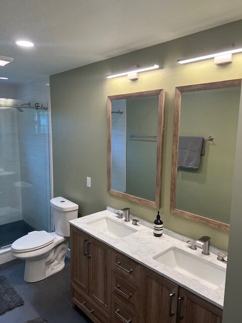 Double vanity and glass shower with spa-like design with incredible water pressure. - 953 13th Ave S