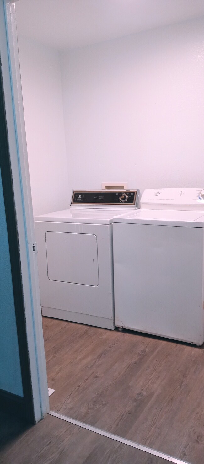 Laundry room off of Kitchen - 7839 Spectrum Ave