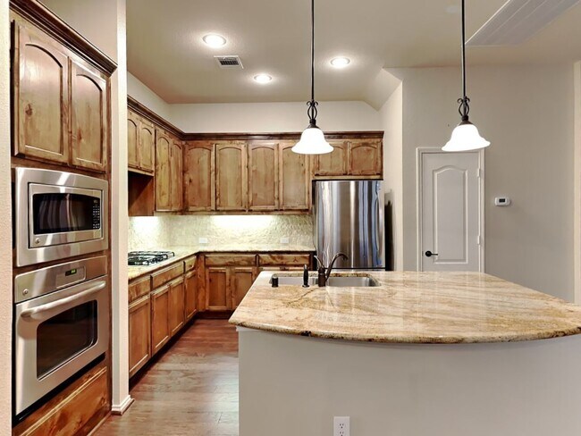 Building Photo - Sophisticated Style, Designer Updates & Gated Community Living