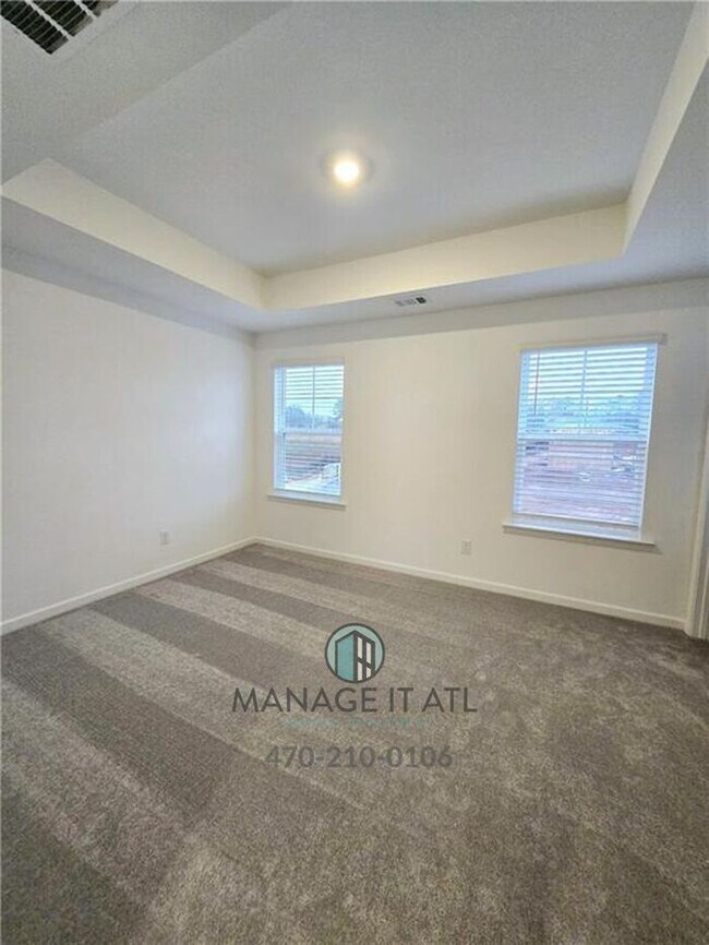 Building Photo - Beautiful End-Unit three-story townhome in Tucker