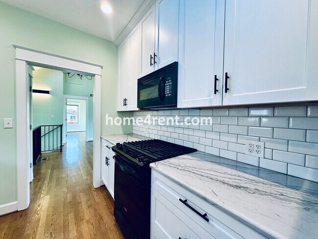 Building Photo - Charming Home Near Country Club Plaza w/ Gorgeous Updates, Wood Floors and a Two Car Garage!