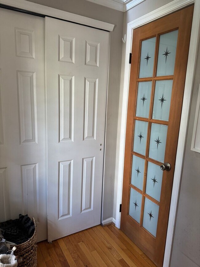 Building Photo - Stunning 3–4 Bedroom Townhome in Private Community | Garage + EV Charger | Deck with Tree Views