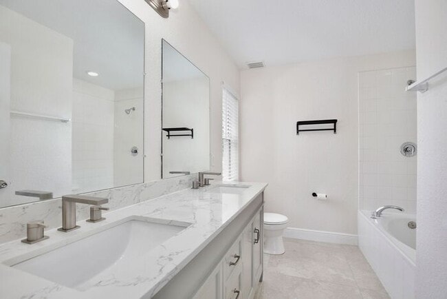 Building Photo - Beautiful 3/2 Spacious Home with a covered patio and a 2 Car Garage in Villa Homes Village - St C...