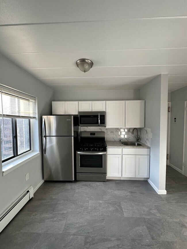 Building Photo - Rose Garden - Your Gateway to Modern Living and Seamless NYC Commutes!