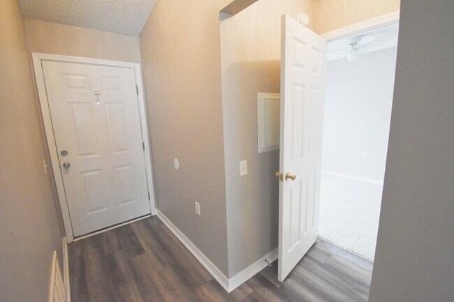 Building Photo - 2BR Patio Home with Open Layout, LVP Flooring, Private Fenced Yard, HOA Lawn Care & Convenient Bl...