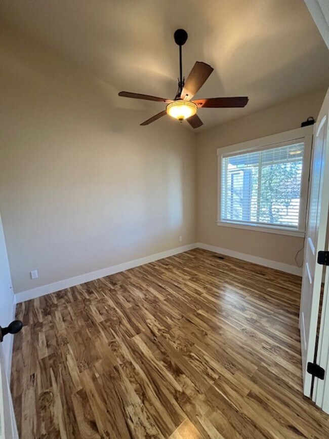 Building Photo - THREE-CAR GARAGE! This charming home offers 3 bedrooms, plus an office/rec room, and 2 bathrooms.