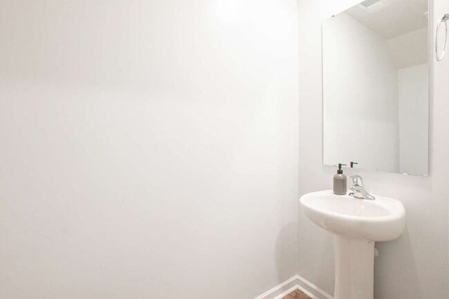Building Photo - Partially furnished and now available!