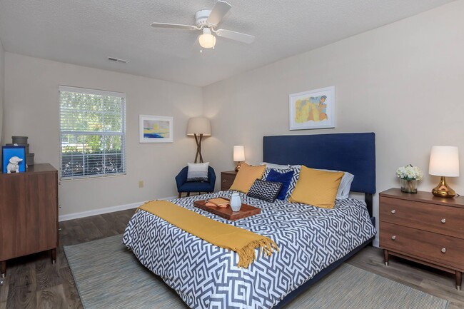 Master Bedroom with Ceiling Fan - Gold Interior - Ashley Oaks Apartments