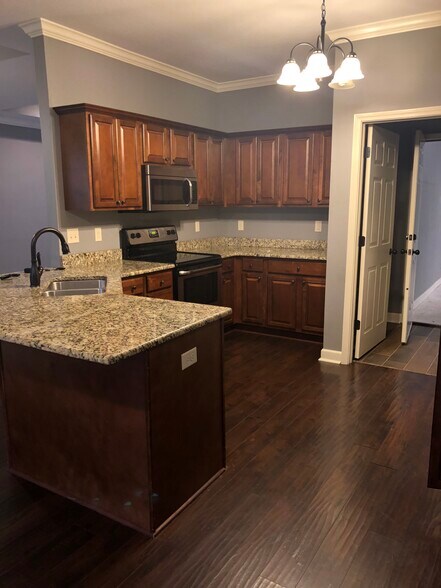Well appointed kitchen with stainless steel appliances. - 1700 Wilson Rd