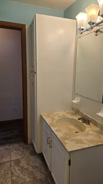 Bathroom sink with cupboards - 1103 Beechwood Dr