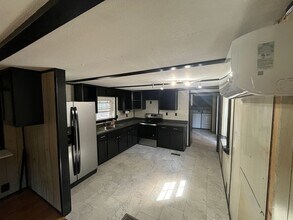 Building Photo - $1500 — 2 BEDROOM 1 BATH — Off Howard Gap Rd