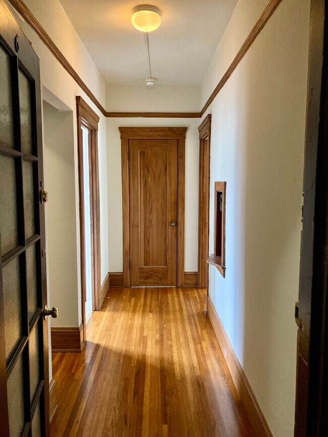 Entry hallway looking towards walk in closet door - 1240 7th Ave