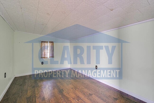 Building Photo - Updated house with carport and shed on corner lot!