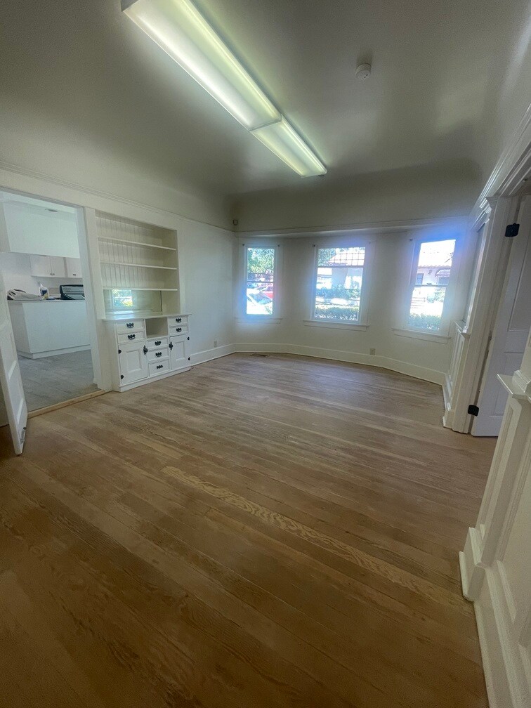 Large dedicated dining room with built-in cabinets and leaded windows. Restored hardwood floors bef - 1135 Magnolia St