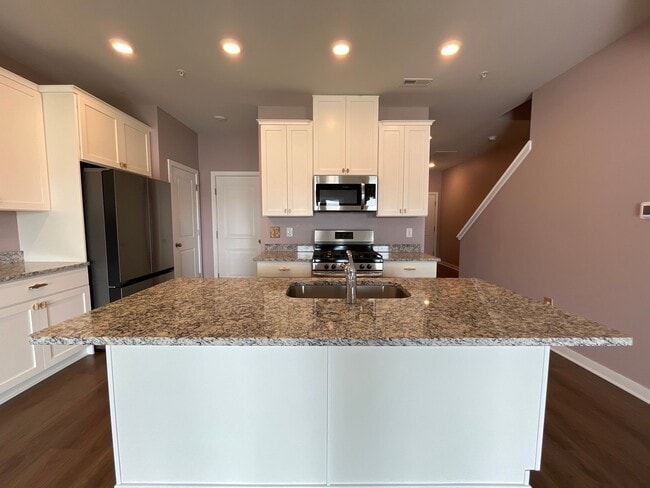 Building Photo - Move-in-ready Brookside Court townhome off...
