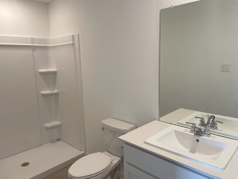Primary bathroom with walk in shower - 25665 Rose Creek Dr