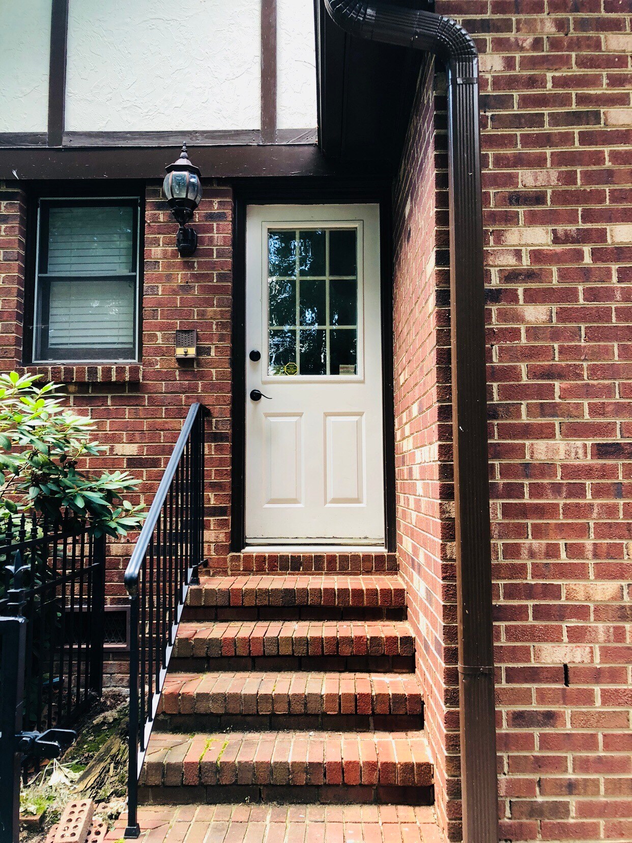 Side entrance from driveway leads to coat closet, half bath, and eat-in kitchen - 3 Tyrol Ct