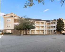 Building Photo - Stunning Top-Floor 2-Bedroom Retreat with Serene Pond Views!