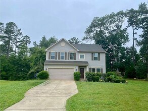 Building Photo - Spacious 4-Bedroom Home with Sunroom, Deck...