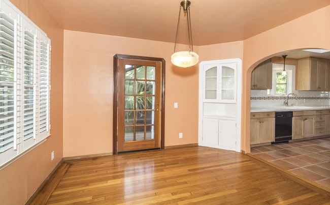 Building Photo - Charming Spanish Style Cottage with Incredible Deck- Gardener's Delight!