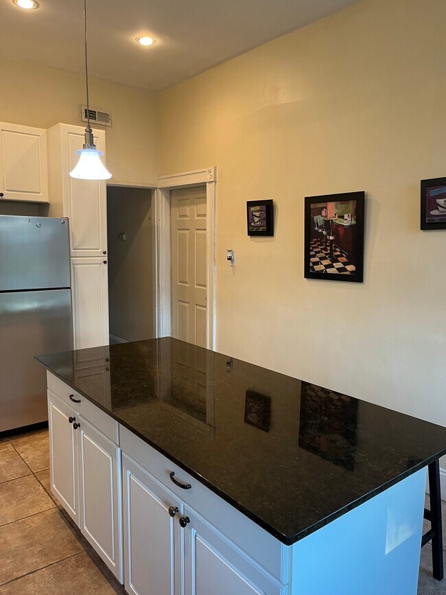 Kitchen with full stove; microwave, dishwasher, air fryer, and Keurig - 2219 Missouri Ave