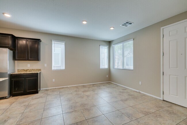 Building Photo - Spacious Townhouse with Loft & Rare 3-Car Garage!