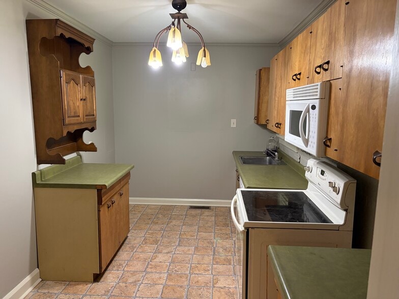 Kitchen. Will have a fridge in back left - 900 S Grant Ave