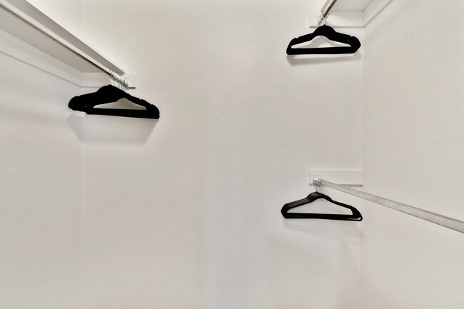 Both bedrooms offer walk-in closets with plenty of designer hangers. - 12414 W Nugget Ct