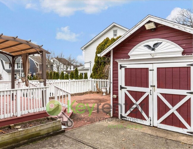 Building Photo - Spacious 3-Bed, 2-Bath Nutley Home with Bonus Office, Multi-Level Deck & Quiet Location