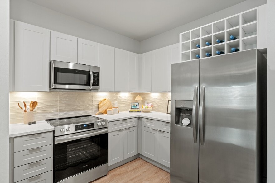 Kitchen with Quartz Countertop and Stainless Steel Appliances - Botanic Miramar Beach