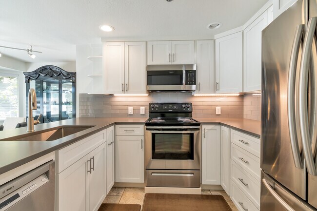 Kitchen with SS appliances. - 19404 Bothell Way NE