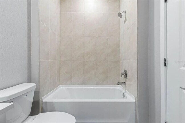 Building Photo - Brand New Townhome Overlooking the 15th Fairway