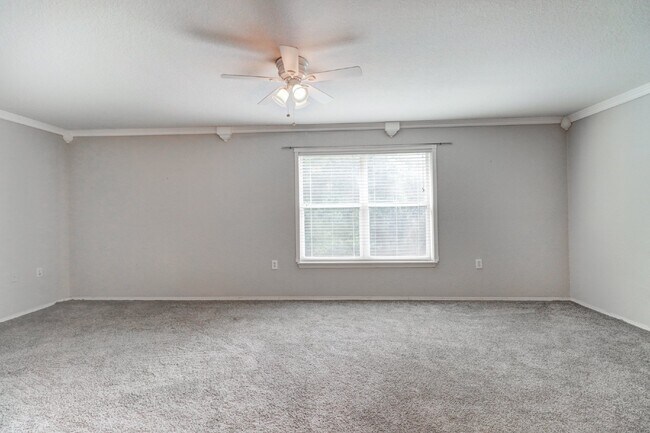 Building Photo - Gated Tampa Palms Townhome with 2-Car Garage, Screened Lanai & Community Pool