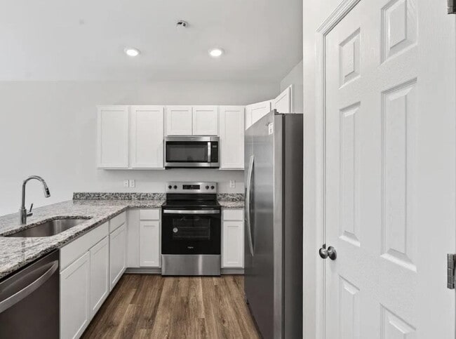 Building Photo - Free Application Fee — Refunded Upon Approval Through August 31! Modern 3BR/3BA Townhome with Gar...