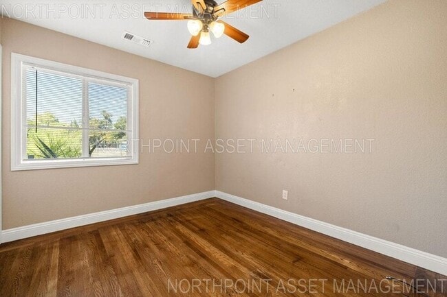 Building Photo - Welcome to this stunning 4-bedroom, 2-bath...