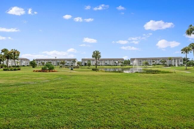 Building Photo - first-floor unit featuring a 2 bedroom, 2 bath fully furnished