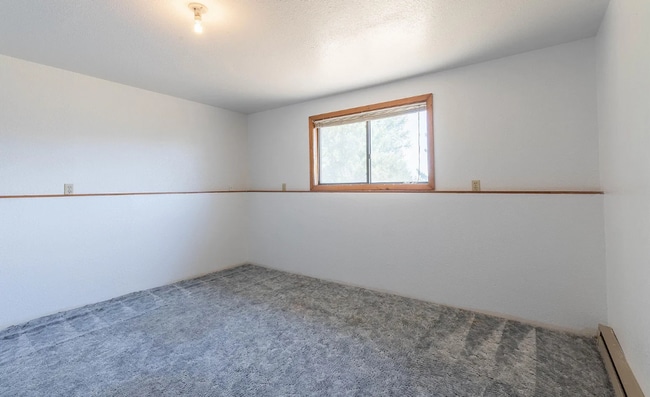 Building Photo - Three bedroom two bath home in a quiet nei...