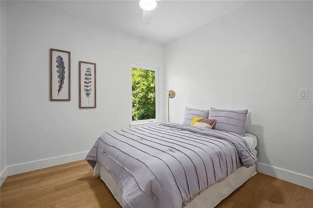 Bedroom 1 with ample closet space covered by a sliding door. - 5402 Duval St
