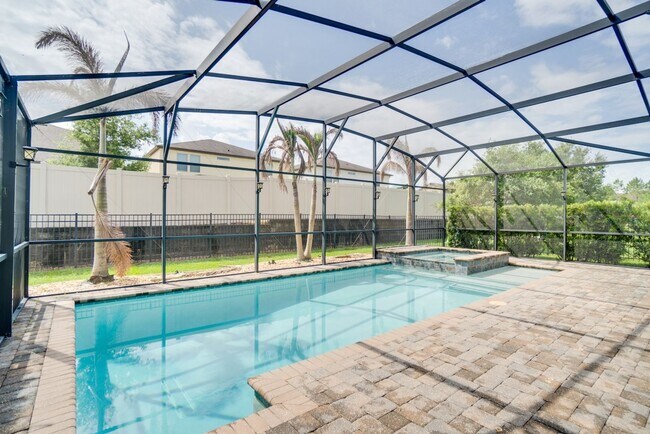 Building Photo - Stunning 3-Bedroom Pool Home with Bonus Room in the Gated Community of Lakeshore at Narcoossee